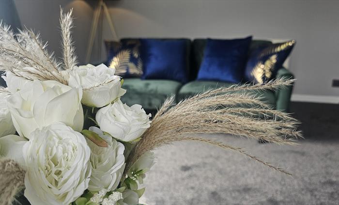 The Redford Cwtch Lounge – a cosy, welcoming space with soft seating, warm lighting, and rustic charm, perfect for relaxing with family or friends aft